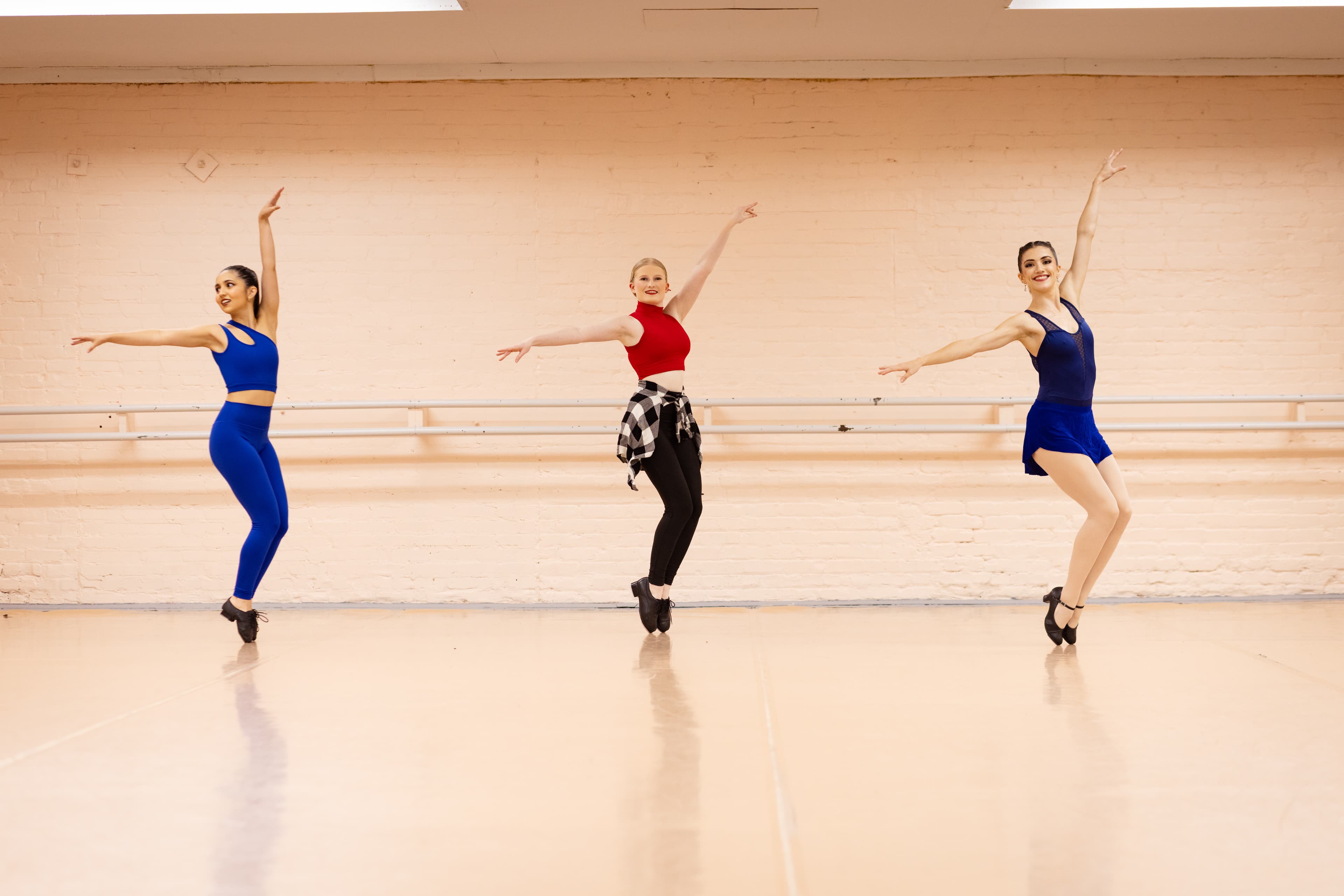 Three dancers in jazz class